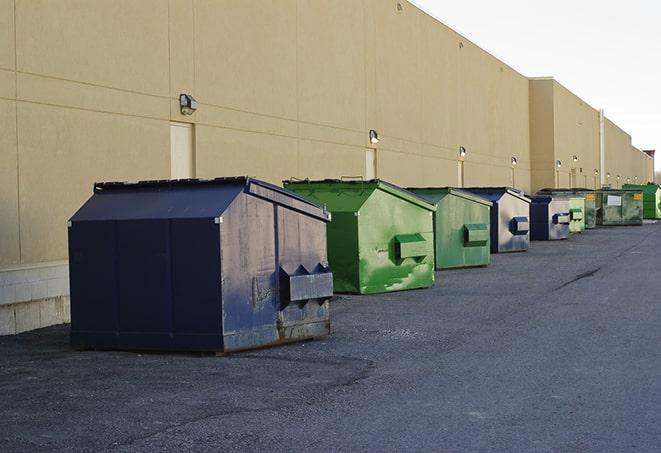 construction waste bins waiting to be picked up by a waste management company in Cromwell